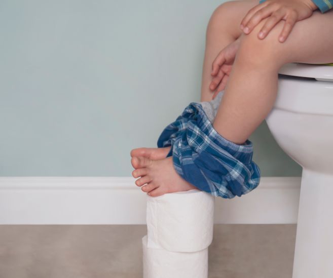 child sitting on toilet overactive bladder