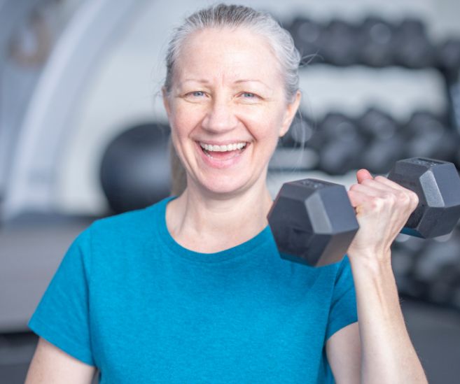 woman lifting weight osteoporosis
